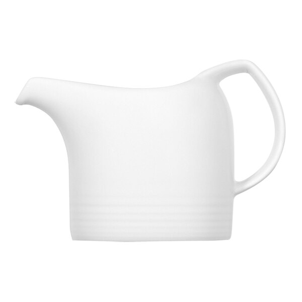 A Bauscher bright white porcelain creamer with a handle.