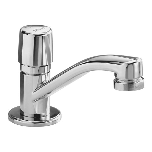 A Delta chrome metering lavatory faucet with a push handle.