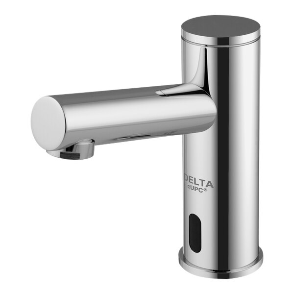 A silver Delta touchless faucet with a button.