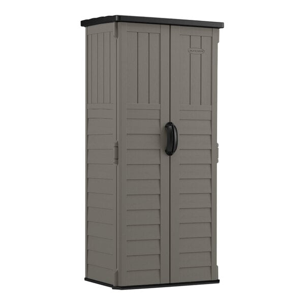 A grey plastic Suncast storage shed with two doors.