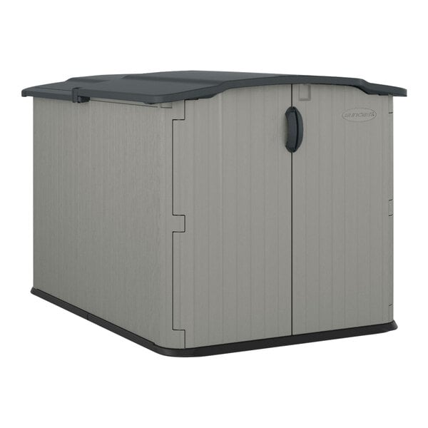 A Suncast Dove Gray horizontal storage shed with a black lid.