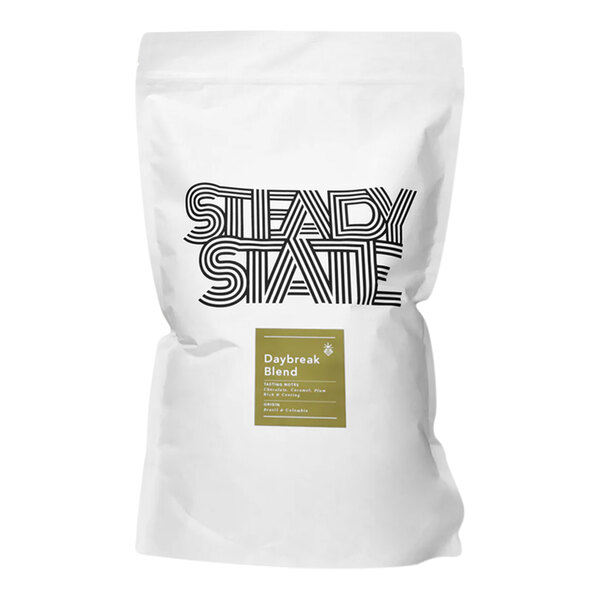 A white bag of Steady State Roasting Daybreak Whole Bean Coffee Blend with black text and a green and white logo.