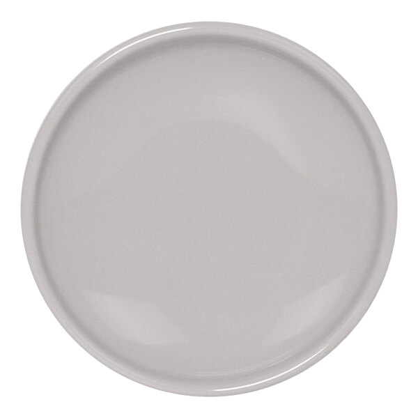 A white plate with a circular pattern on it.