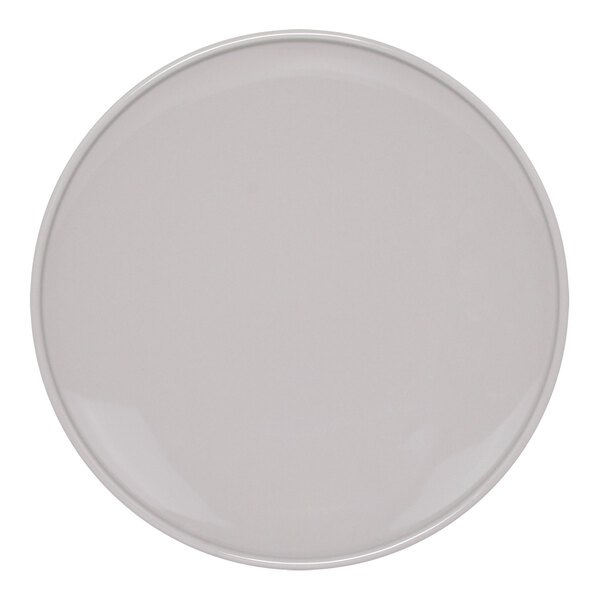 A Front of the House white porcelain plate with a round white border.