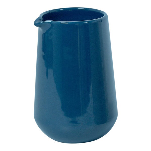 A blue ceramic pourer with a spout.