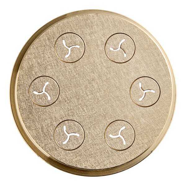 A circular brass object with holes in it.