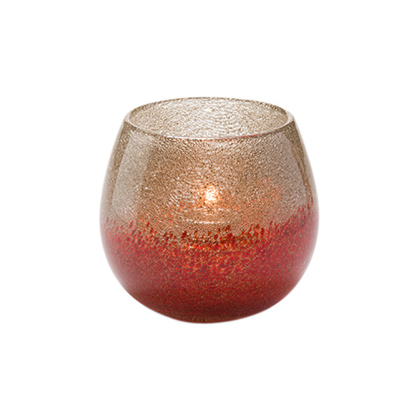 A Hollowick Hope Bubble Glass Votive candle holder with a lit candle.