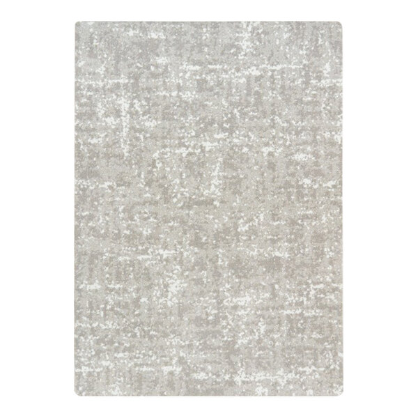 A close-up of a gray rectangular area rug with a white background.