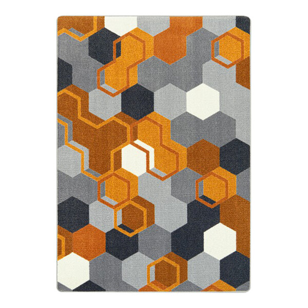 A Joy Carpets orange area rug with hexagons and squares in orange, grey, and black.