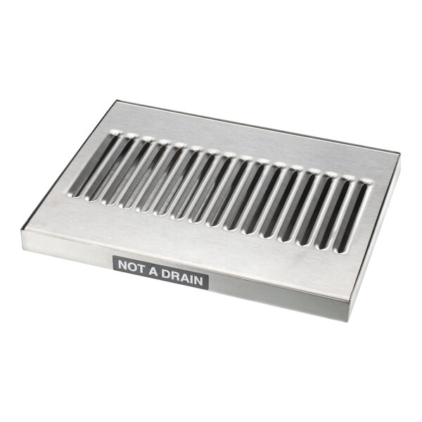 A stainless steel metal drain cover with vent holes for a Wilbur Curtis WCDT-09.