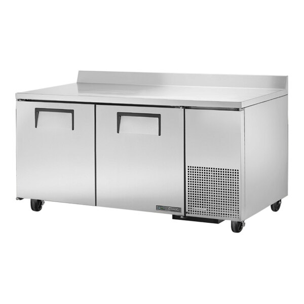A True worktop refrigerator with a stainless steel countertop and drawers.