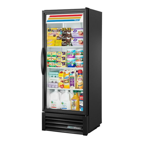 A True black refrigerated glass door merchandiser full of dairy products.