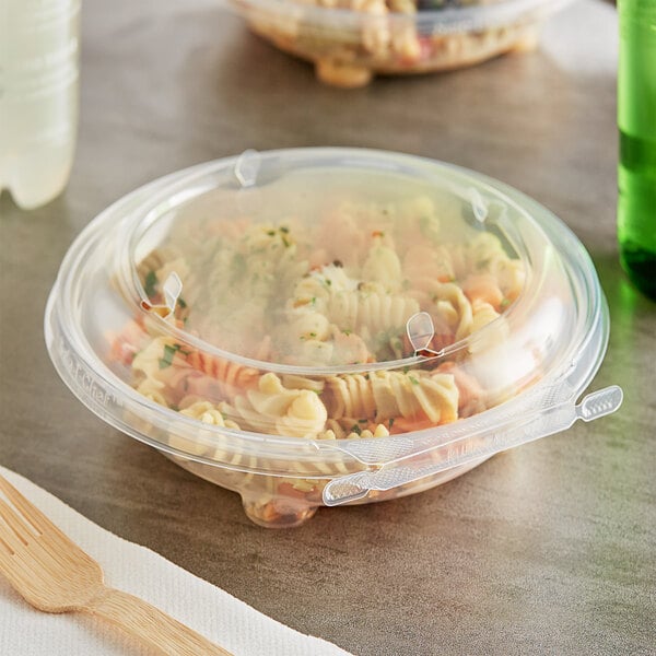 An Inline Plastics Safe-T-Chef round plastic container with pasta and salad in it.