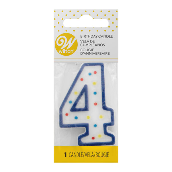 A blue Wilton birthday candle with white polka dots and a number 4 on it.