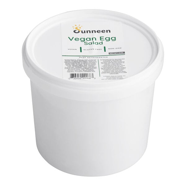 A white container of Sunneen Ready-to-Serve Vegan Egg Salad with a label.