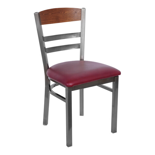 A BFM Seating metal side chair with a burgundy vinyl seat.