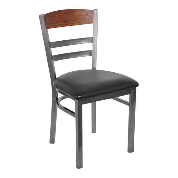 A BFM Seating steel side chair with a black vinyl seat and clear coat finish with black metal accents.