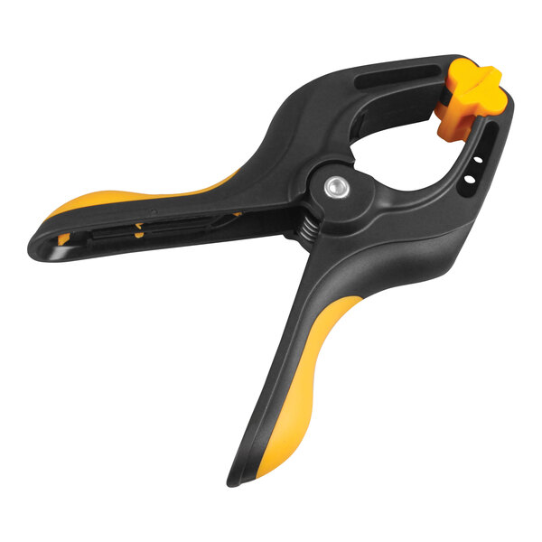 A black and yellow Olympia Tools plastic spring clamp.
