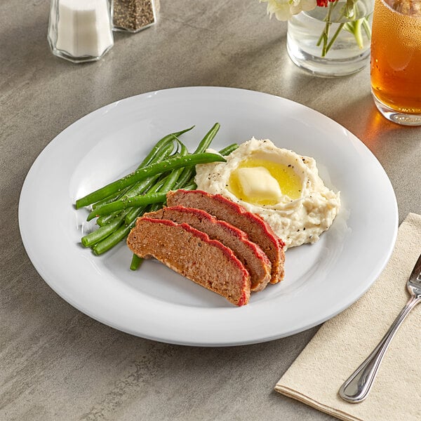 A white Acopa Foundations melamine plate with meatloaf, green beans, and mashed potatoes.