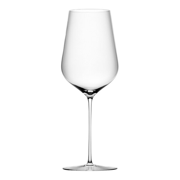 A close-up of a Nude Stem Zero red wine glass with a long stem.