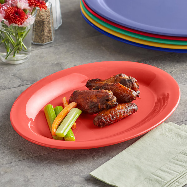 An Acopa Foundations melamine tray with chicken wings and celery sticks on it.