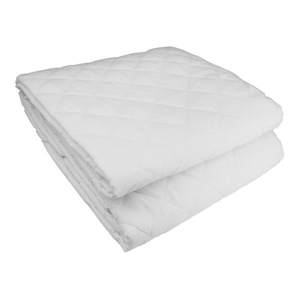 A stack of Oxford white quilted mattress pads.