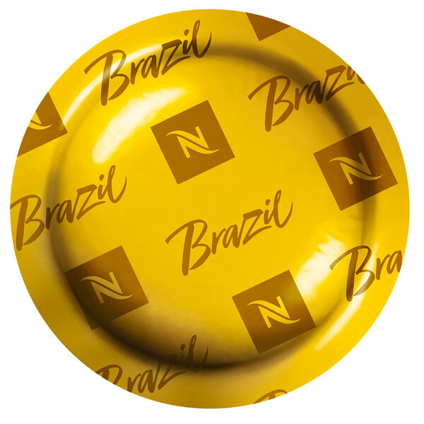 A yellow Nespresso box with black text reading "Brazilian Naturals" on a table.