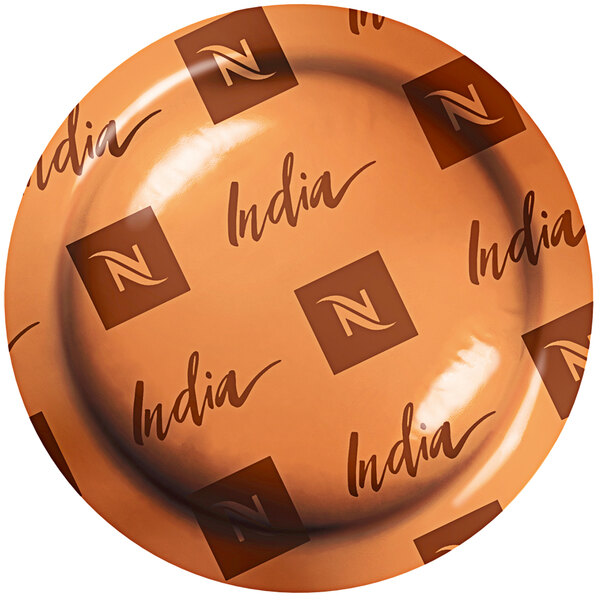 A close up of an orange plate with "India" on it.