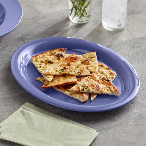 An Acopa purple melamine platter with pizza slices on it.