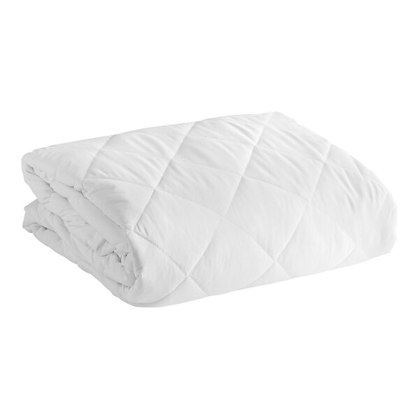 A close-up of a white Oxford quilted mattress pad.