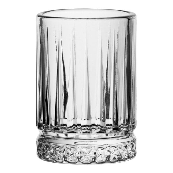 A Pasabahce shot glass with a patterned rim.