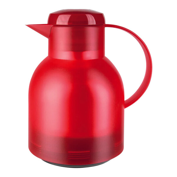 A transparent red polypropylene carafe with a handle.