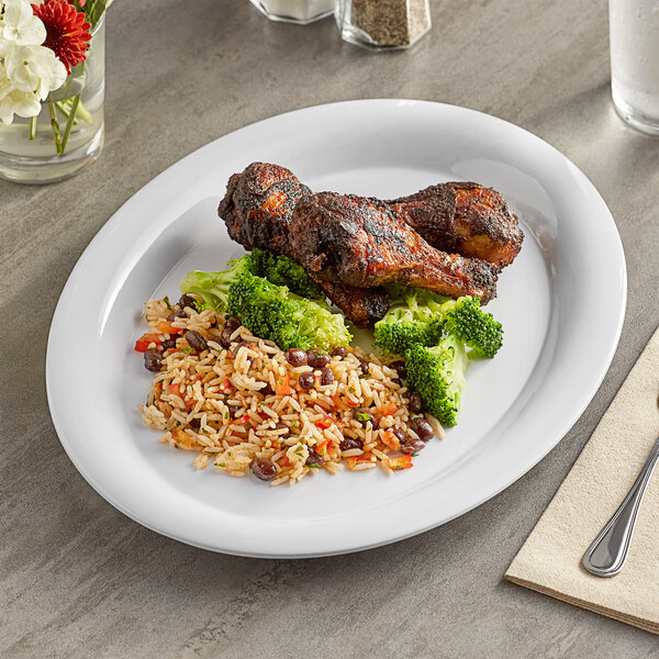 A white Acopa Foundations melamine platter with broccoli, rice, and chicken on a table.