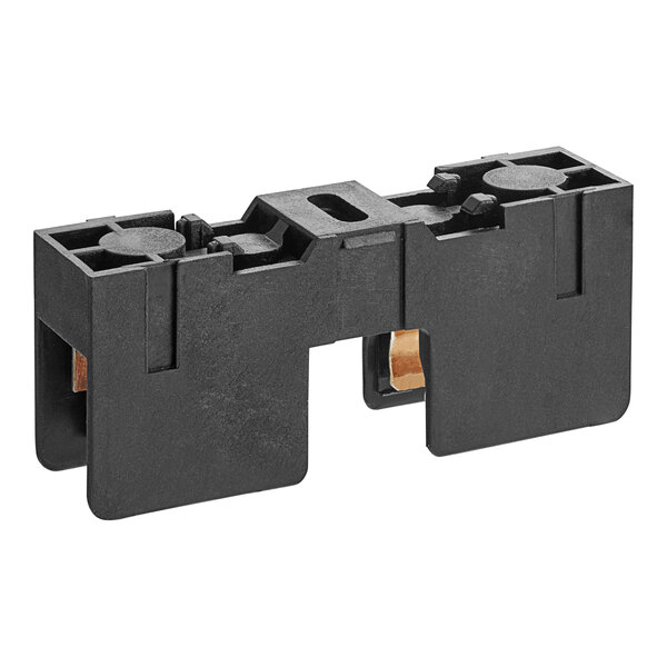A black plastic Solwave fuse holder with gold wires and a hole.