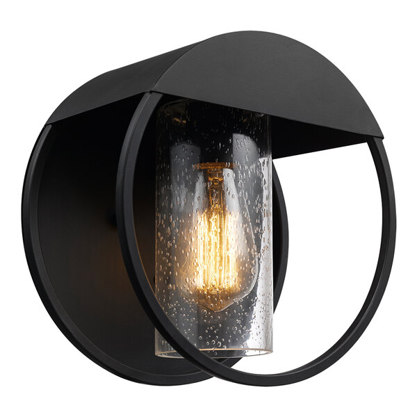 A Globe matte black outdoor wall sconce with a clear seeded glass shade.