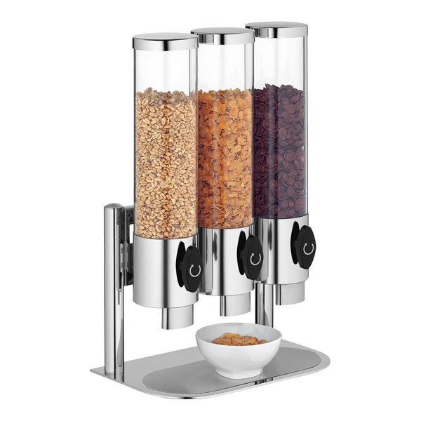 A WMF by BauscherHepp triple canister cereal dispenser filled with cereal.