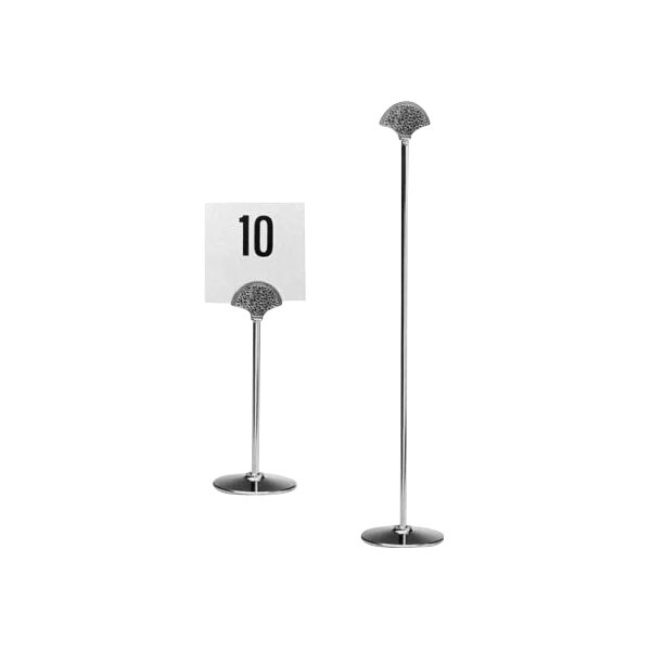A white sign with the number 10 in a Hepp silver table card holder.