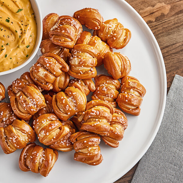 A plate of Eastern Standard Provisions soft pretzel bites and dip.