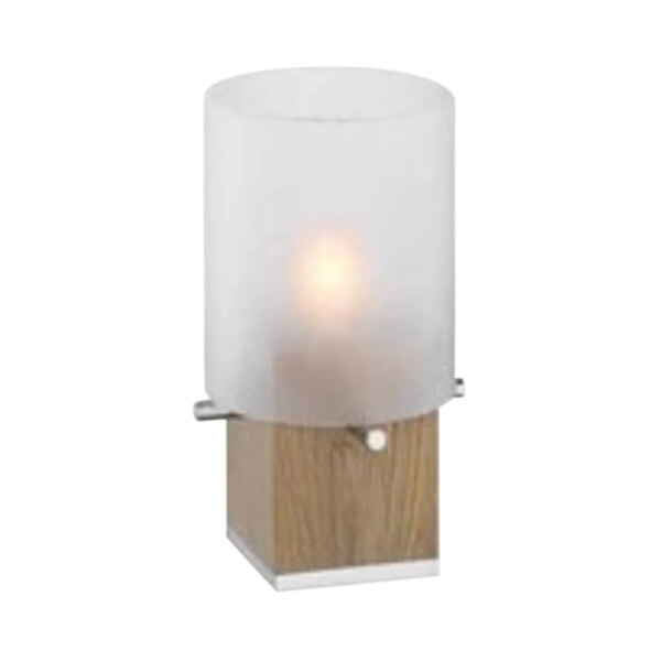 A WMF natural wood tealight holder with frosted glass shade on a wooden base with a lit tealight inside.