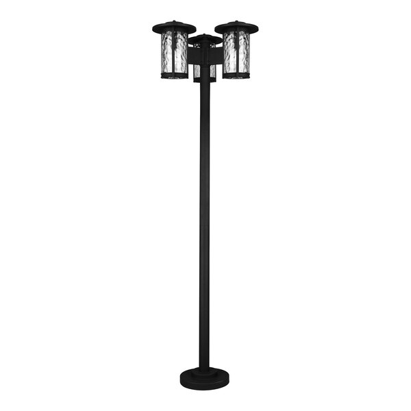 A black Canarm outdoor light post with three lights on it.