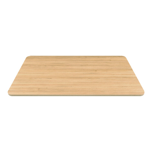 A WMF by BauscherHepp melamine wood grain plate on a wood surface.
