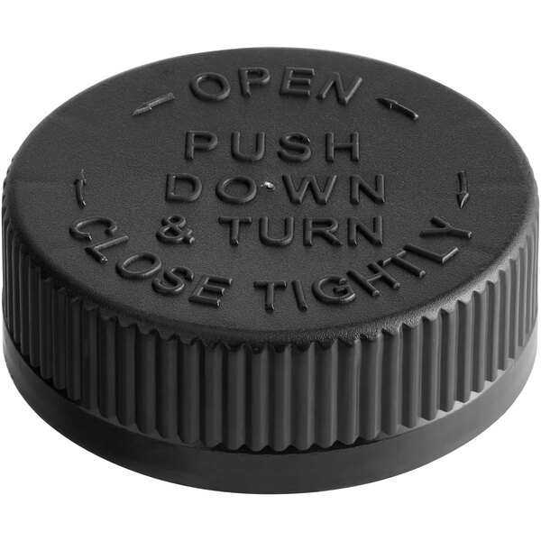 A black plastic child resistant cap with the words "open push down and turn tight" on the top.