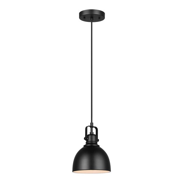 A black Canarm pendant light with a white shade hanging from a black pole above a table in a restaurant.