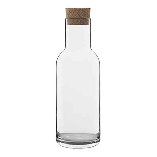 A clear glass bottle with a cork.