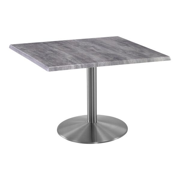 A Holland Bar Stool square table with a metal base and grey wood top.