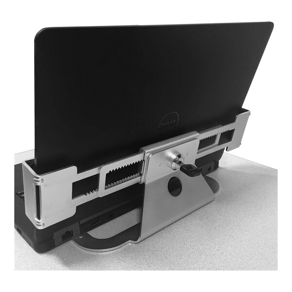 A black laptop secured with a Newcastle Systems steel laptop security bracket.