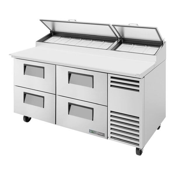 A True commercial refrigerated pizza prep table with drawers.