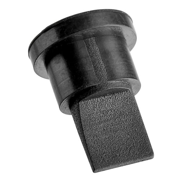 A black plastic Flushmate duckbill valve.