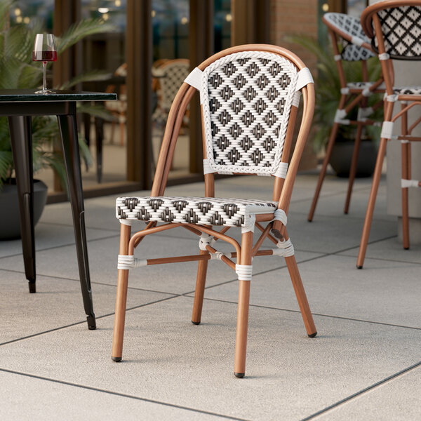 Lancaster Table & Seating Bistro Series Black and White Birdseye Weave Rattan Outdoor Side Chair