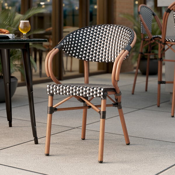 Lancaster Table & Seating Bistro Series Black and White Checkered Weave Rattan Outdoor Arm Chair